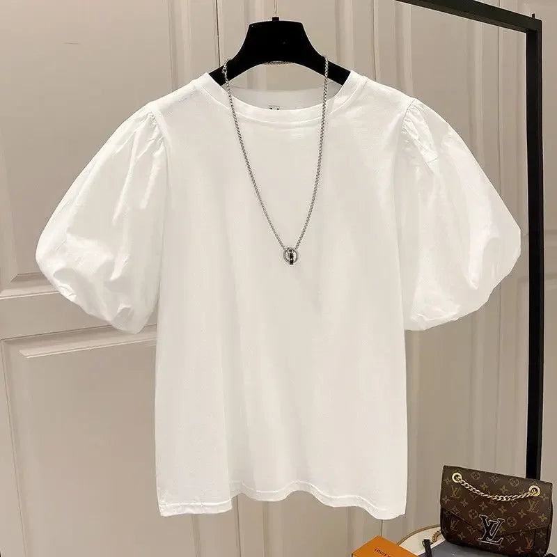 Camiseta mujer  Dulce moda.  cuello redondo y manga abultada.