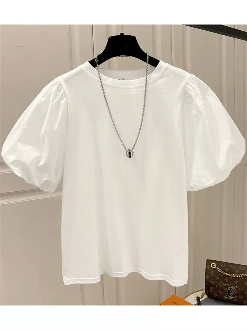 Camiseta mujer  Dulce moda.  cuello redondo y manga abultada.