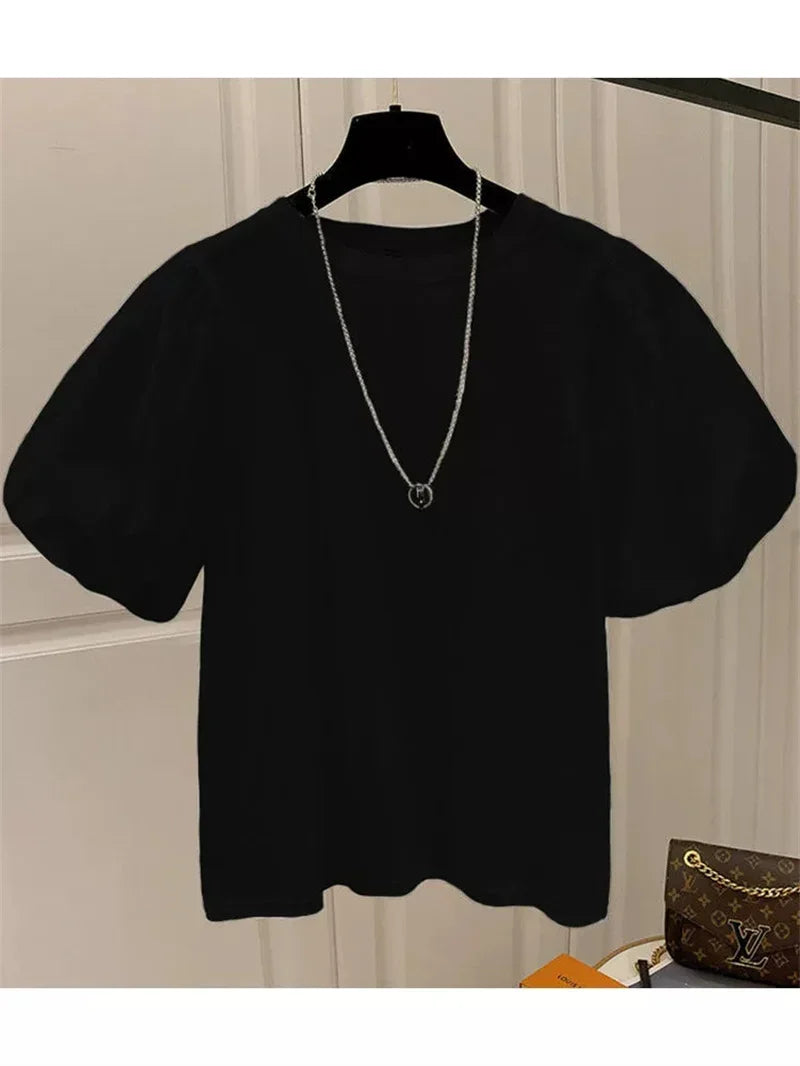 Camiseta mujer  Dulce moda.  cuello redondo y manga abultada.