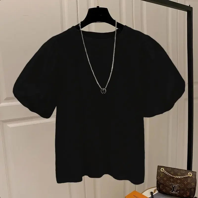 Camiseta mujer  Dulce moda.  cuello redondo y manga abultada.